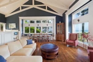 Huge living area with large windows overlooking the beach
